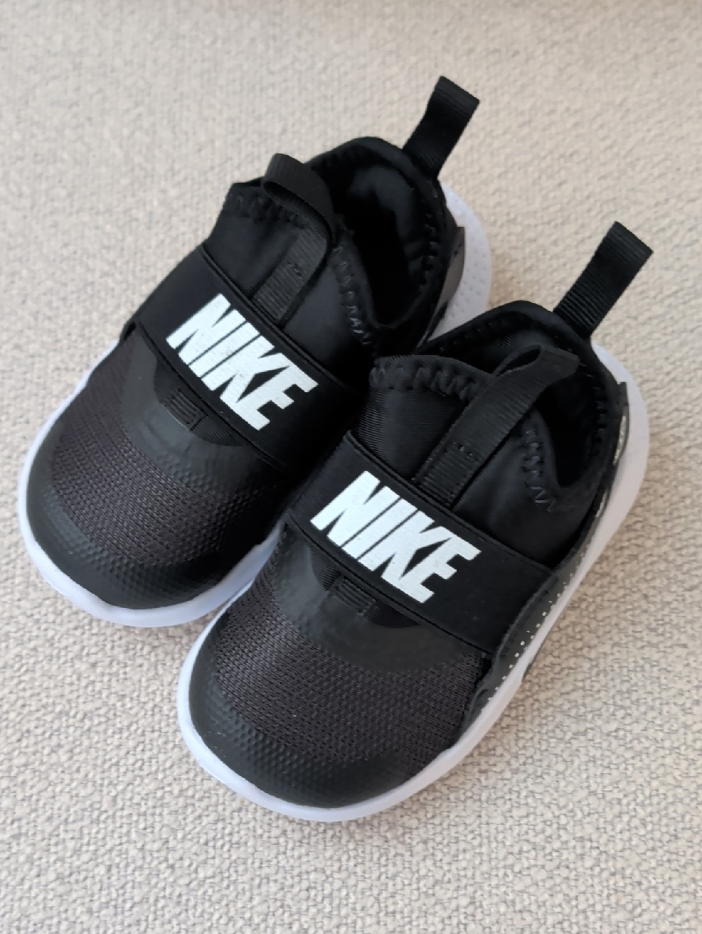 Nike Kids Black with White Logo Slip-On Sneakers